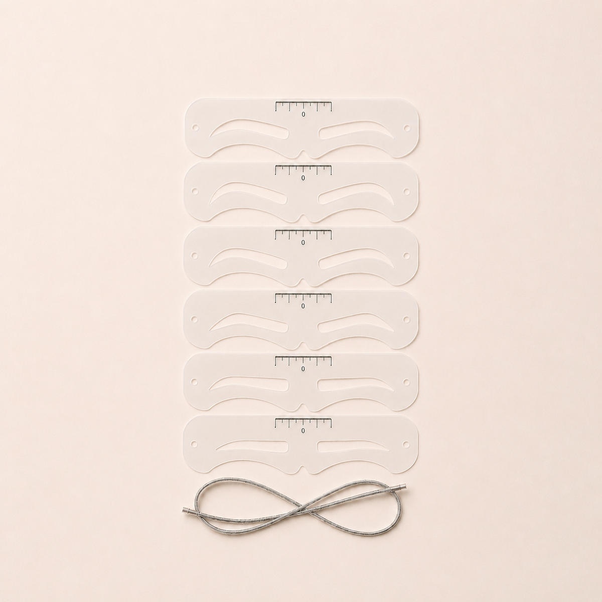 Six REBROWED eyebrow stencil shapes with silver securing cord